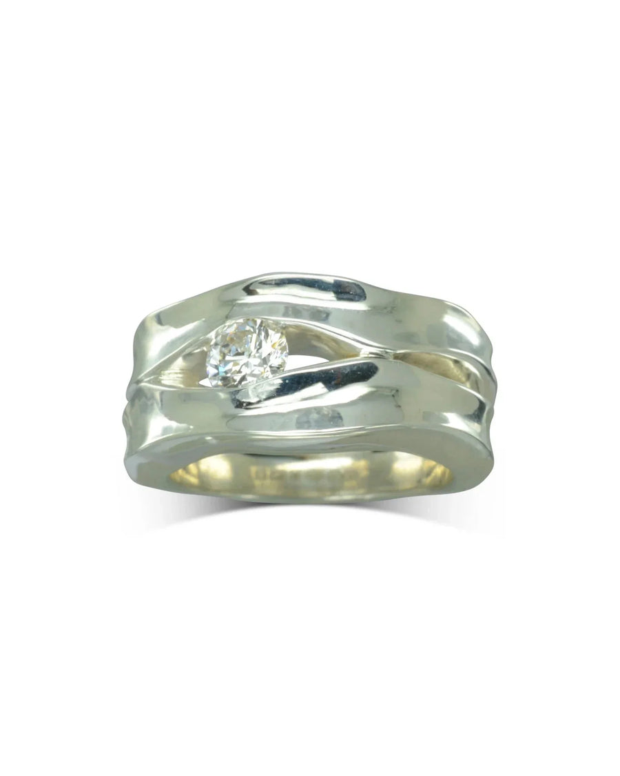 Handmade silver dress ring with a diamond and organic, wavy band texture