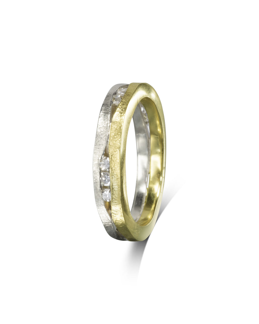 Two-colour diamond ring with a textured trap design.