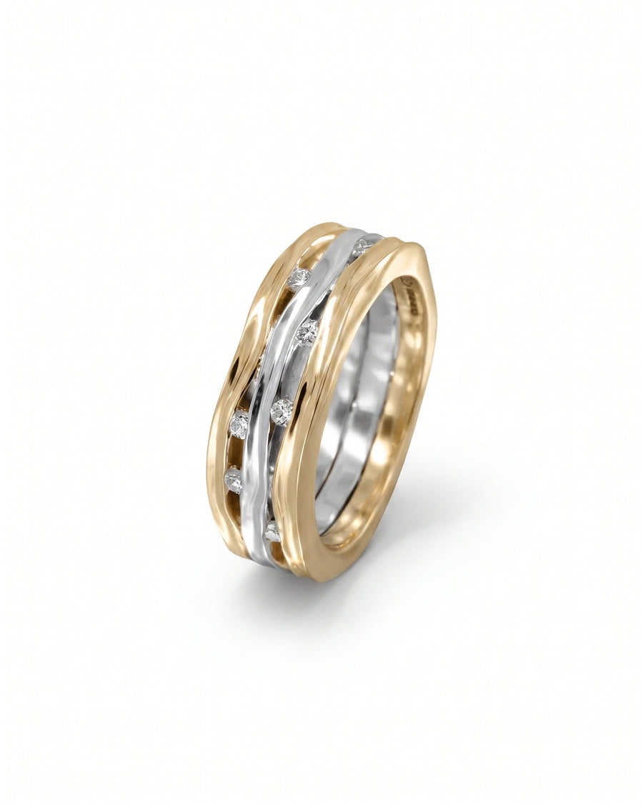 Gold and white gold three-band eternity ring with diamonds.
