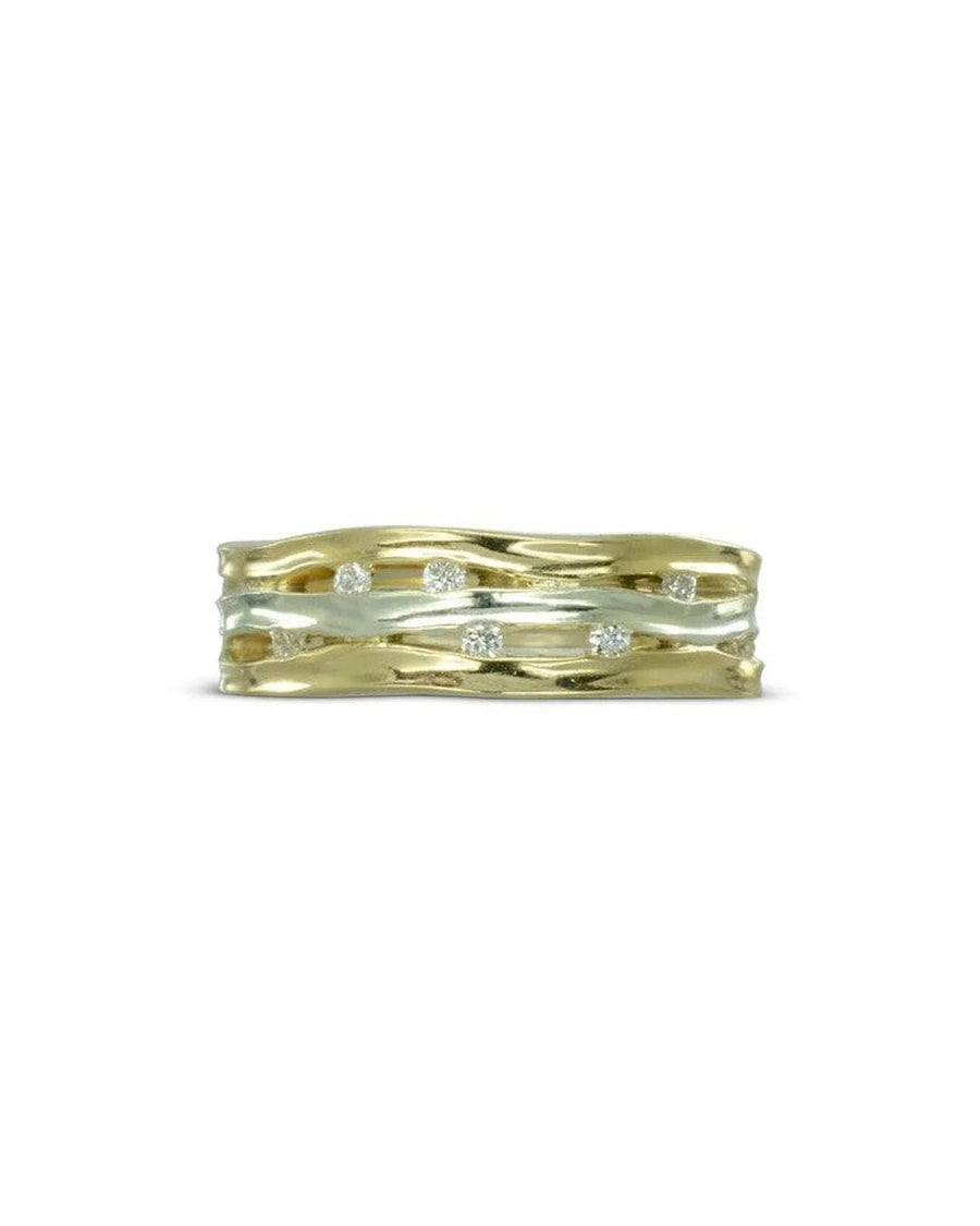 Gold and silver three-band eternity ring with scattered diamonds.