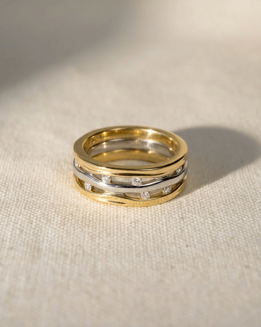 9ct white and yellow gold three-band eternity ring with diamonds.