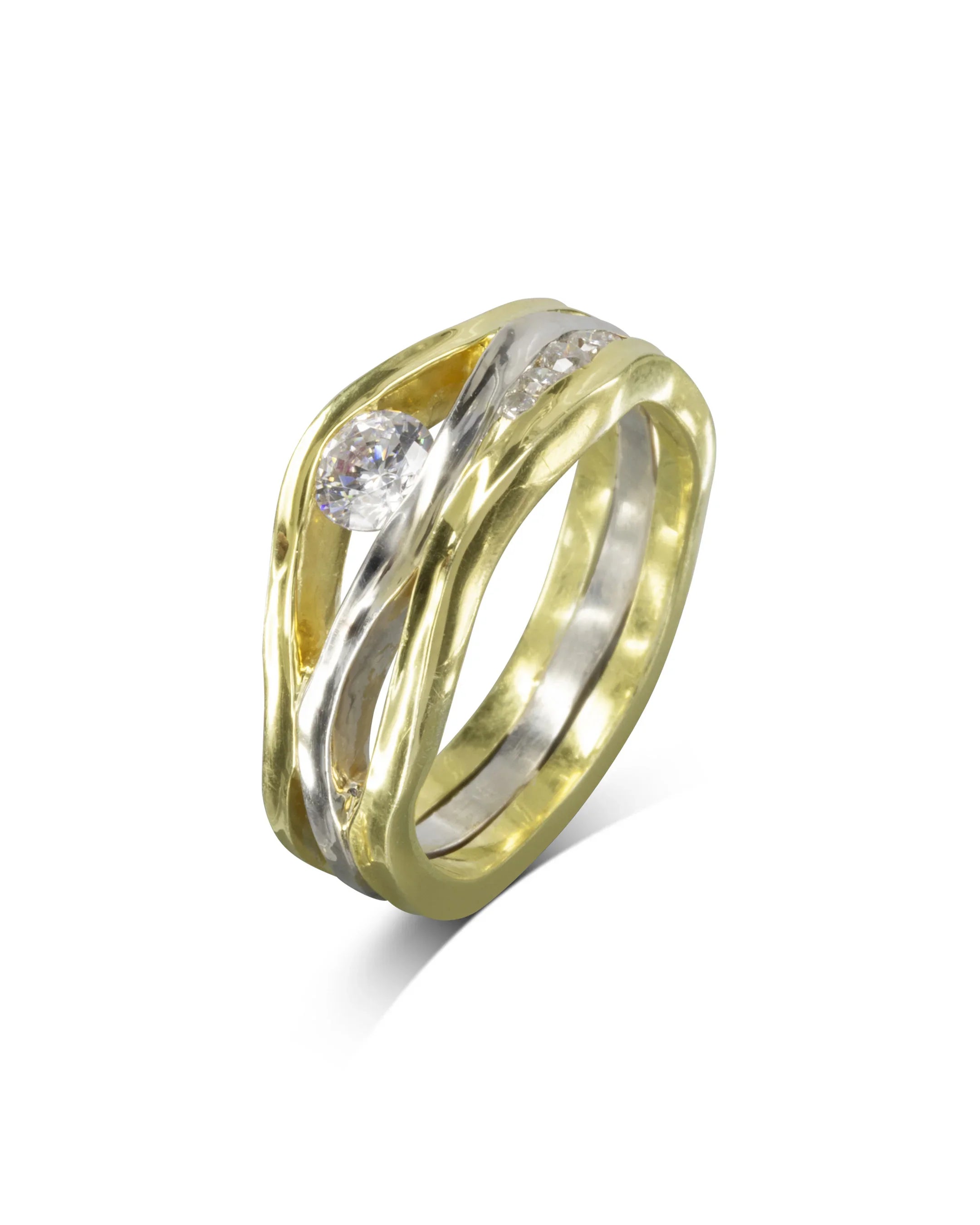Gold and silver three-band ring with a large center diamond and smaller accent diamonds.