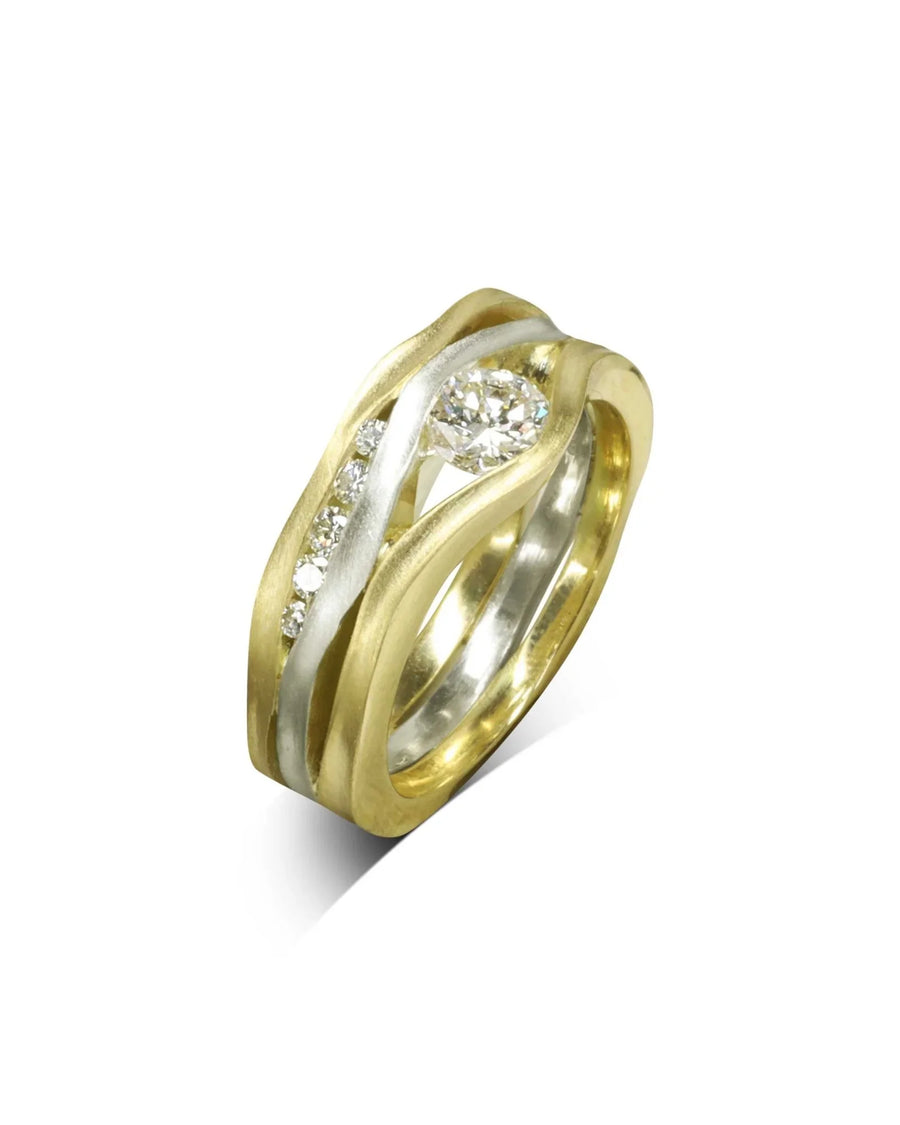Gold and white gold three band diamond ring with a satin finish.