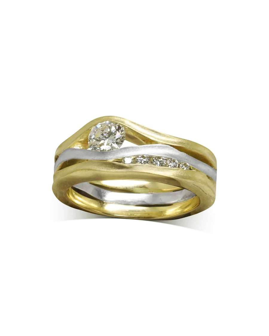 Gold and silver three-band diamond ring with a satin finish.