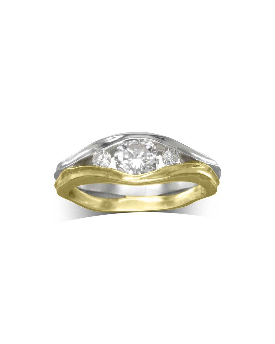 Two-tone gold engagement ring with three round diamonds.