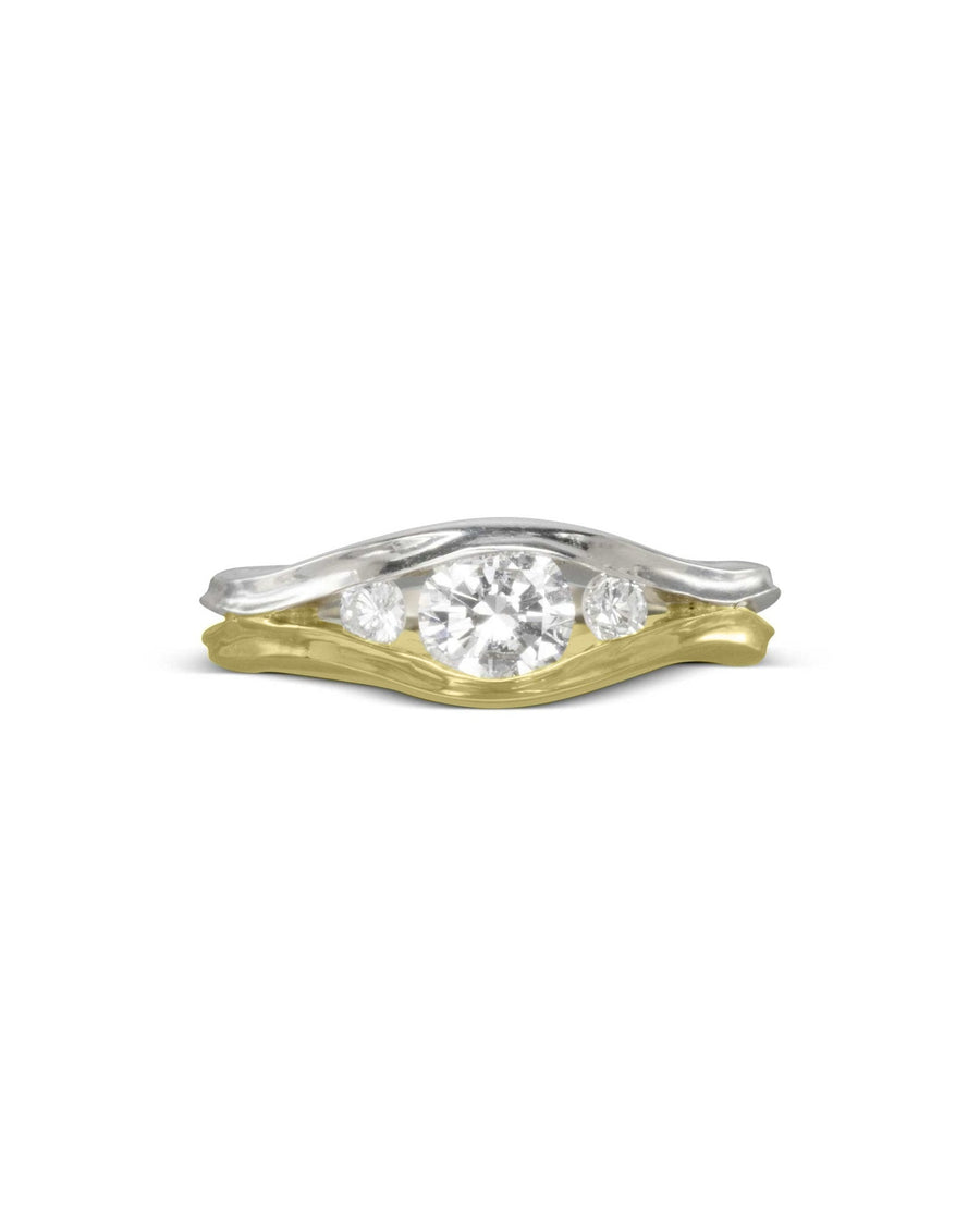 Two-tone gold engagement ring with three round diamonds in a wavy design.