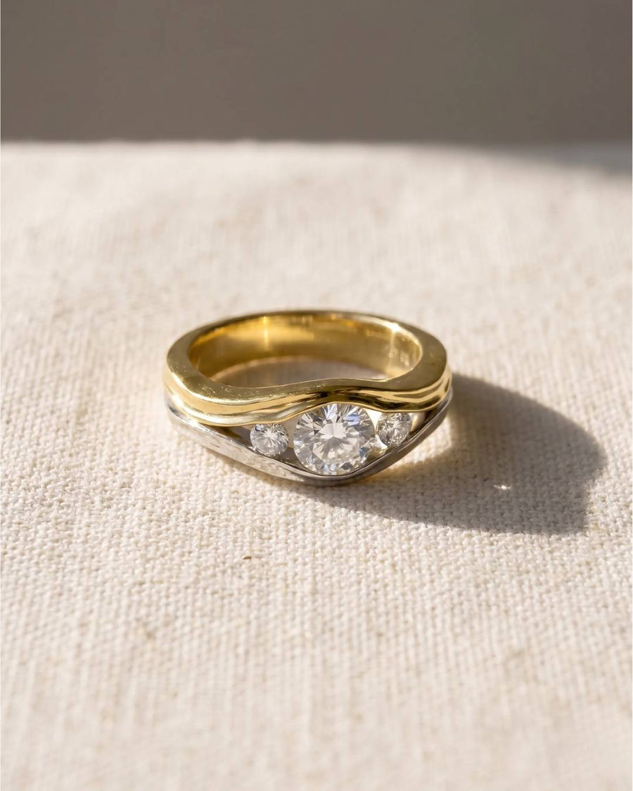 9ct white and yellow gold engagement ring with three round diamonds.