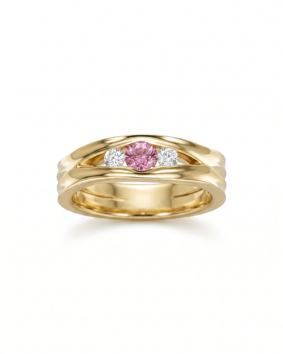 Gold engagement ring with a pink sapphire and two diamonds.