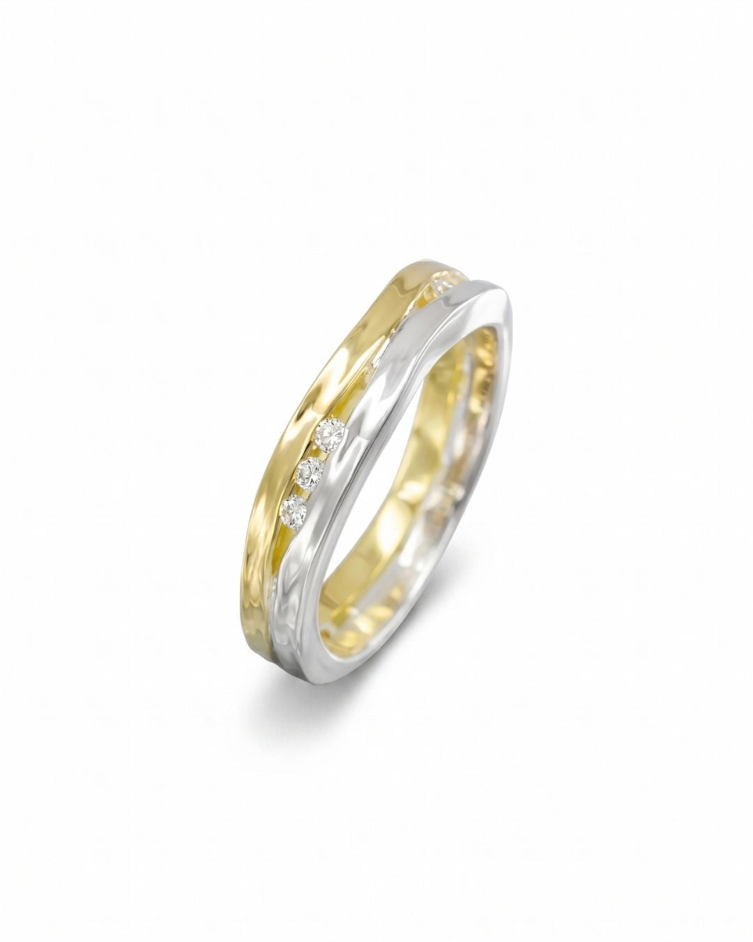 Two-colour gold ring with three round diamonds in a trap design.