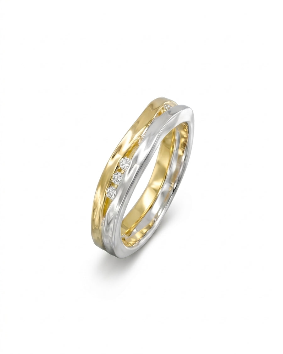 Two-colour gold ring with three round diamonds.