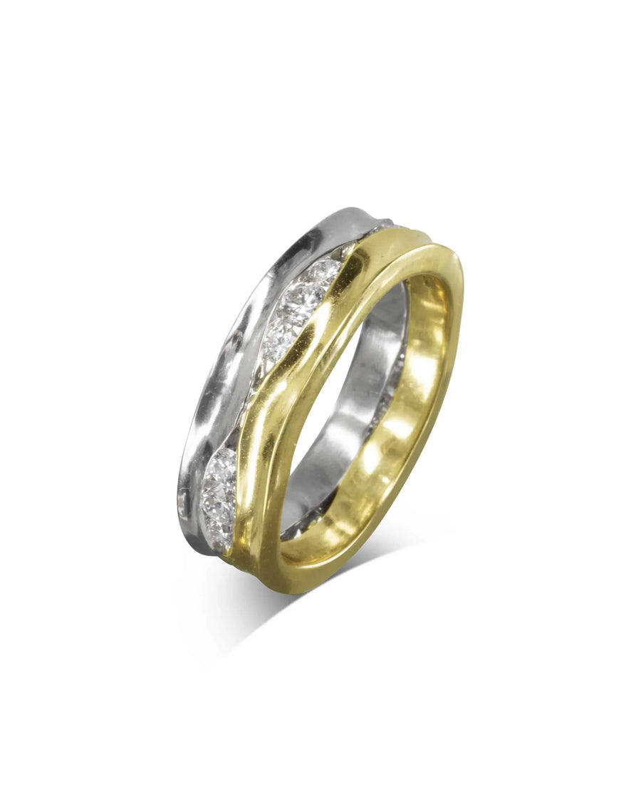 Two-colour gold trap ring with diamonds.
