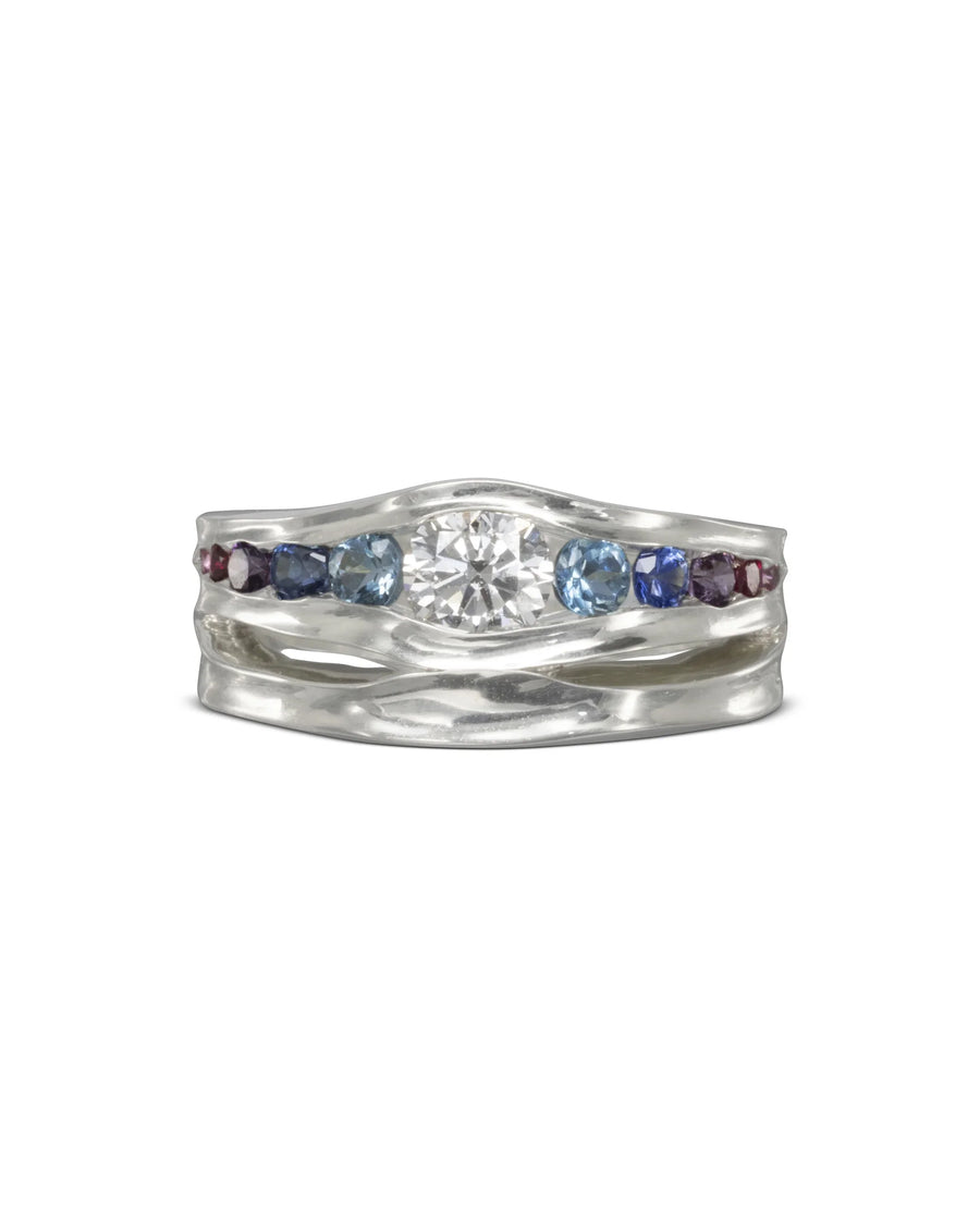 Graduated sapphire and diamond engagement ring with organic silver band and colorful gemstones