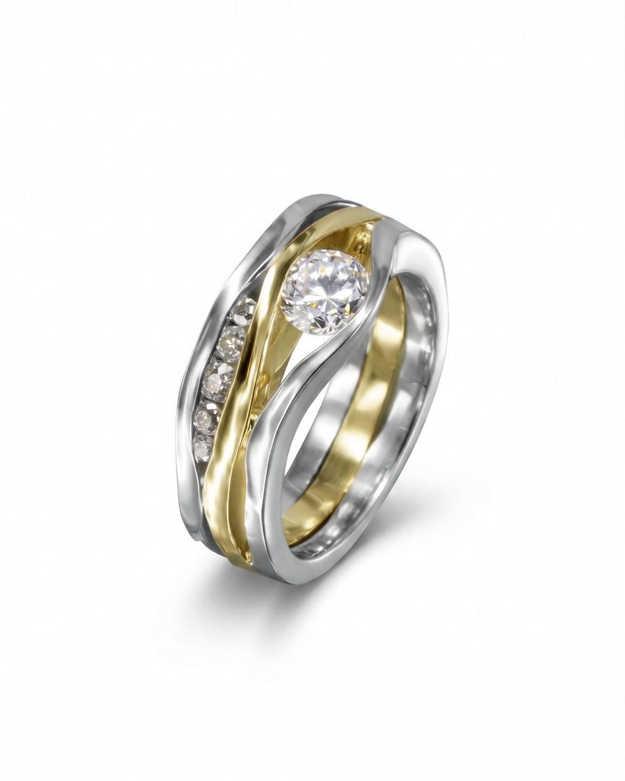 White gold and yellow gold three-band diamond ring with a large center diamond.