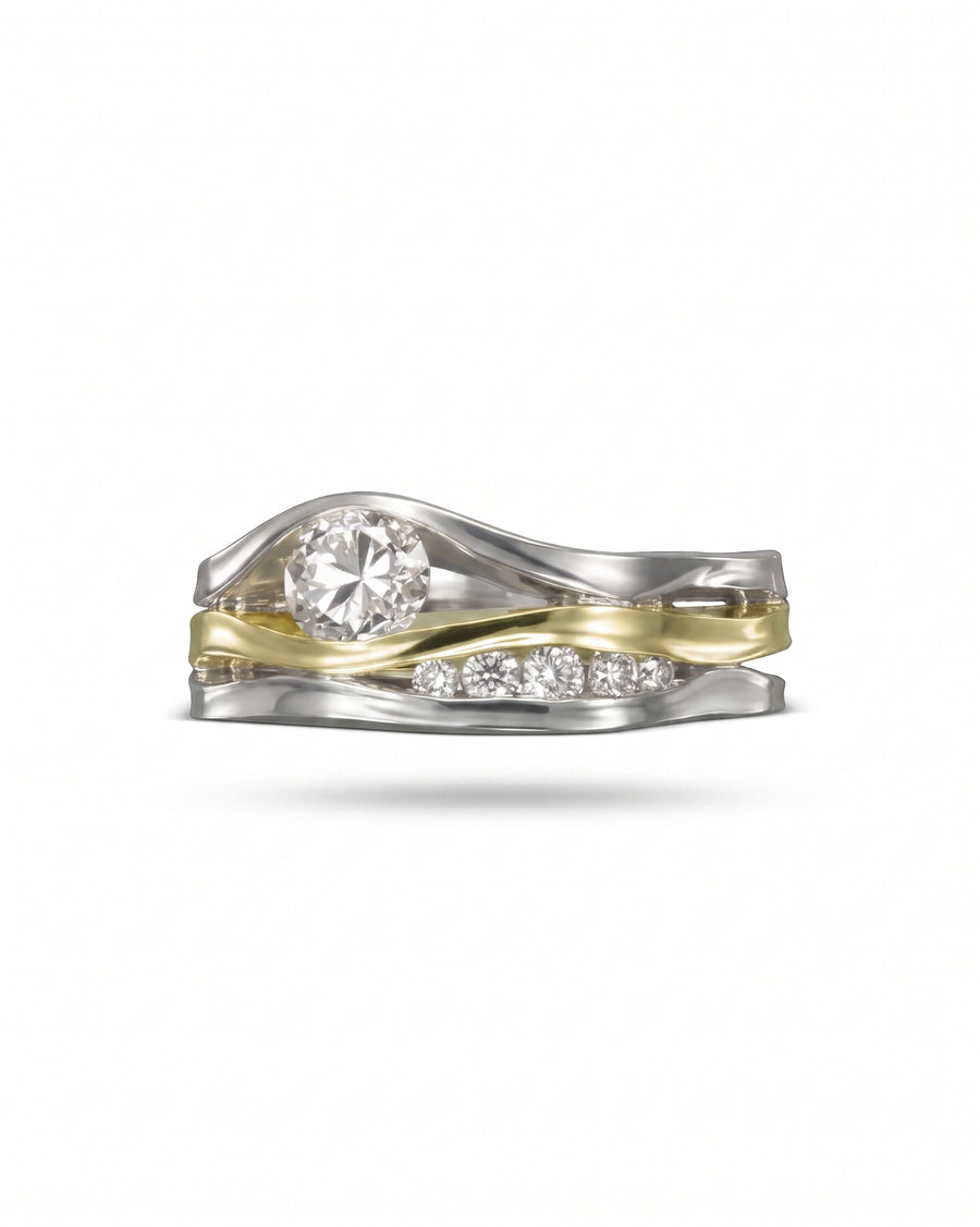 White and yellow gold three-band diamond ring with a round center stone.