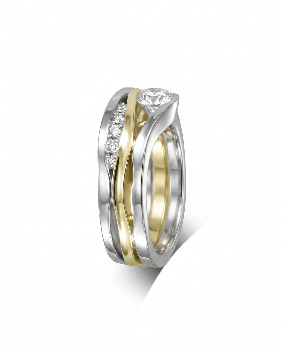 White and yellow gold three-band diamond ring with a round center stone.