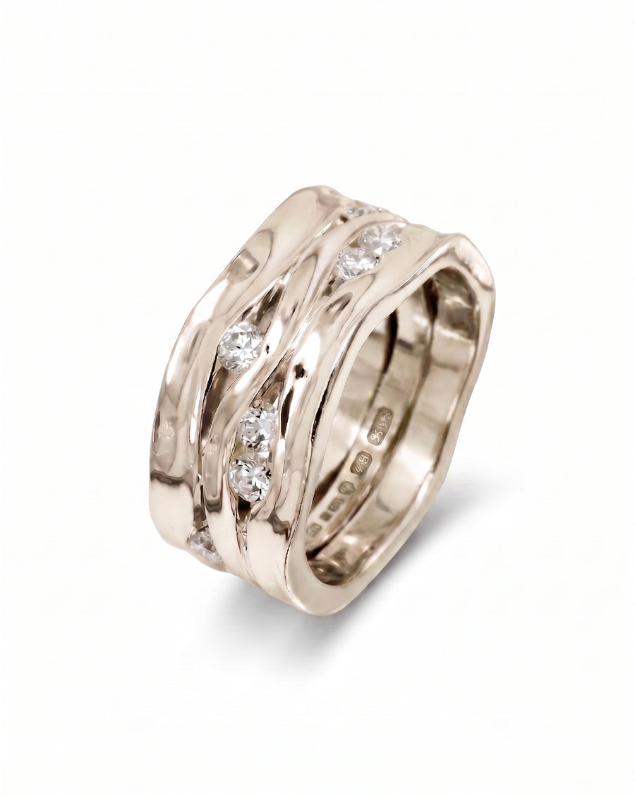 9ct white gold wide three-band eternity ring with round diamonds.