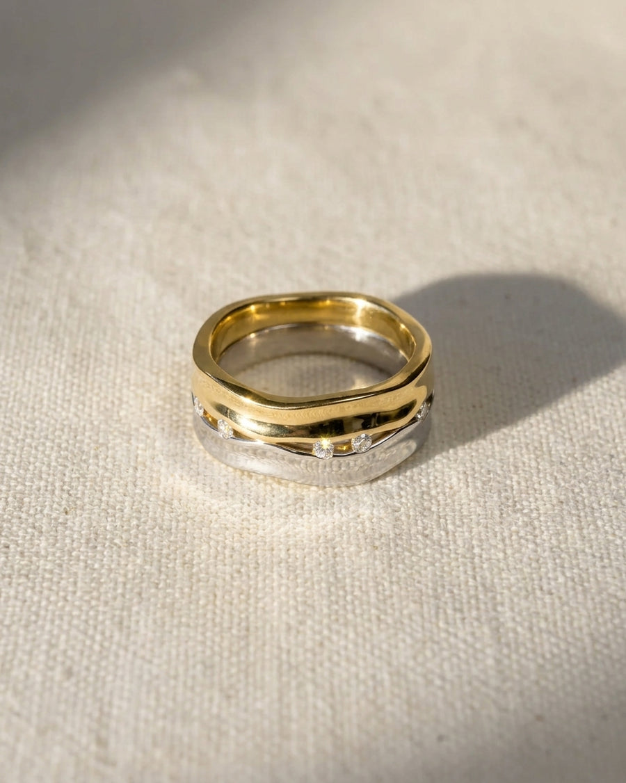 Wide two-colour gold and silver eternity ring with diamonds.