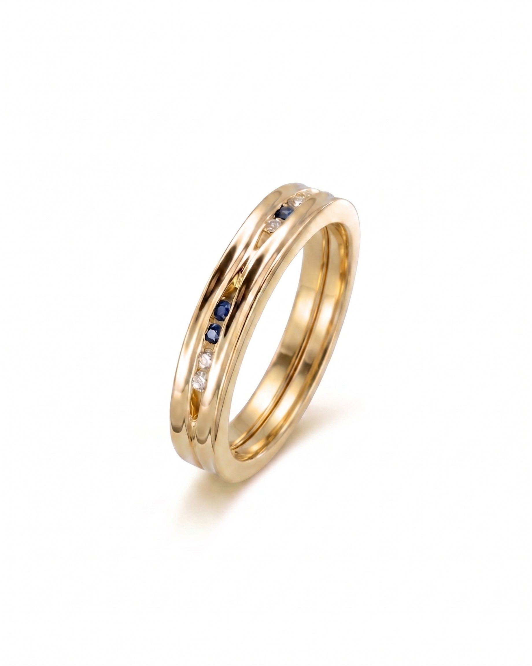 Yellow gold ring with channel-set diamonds and sapphires.