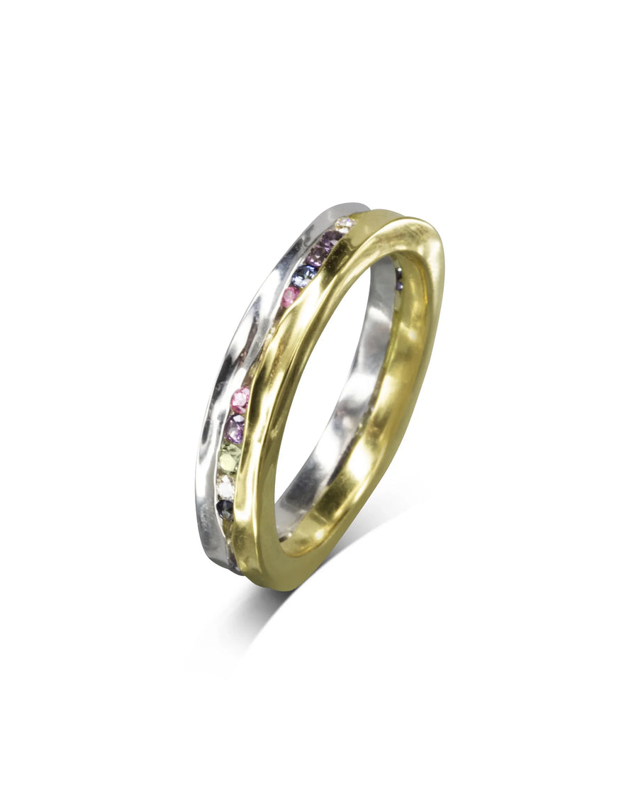 Yellow gold and silver ring with colorful diamond and sapphire gemstones.
