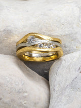 Sussex shore ring with diamond on pebble background