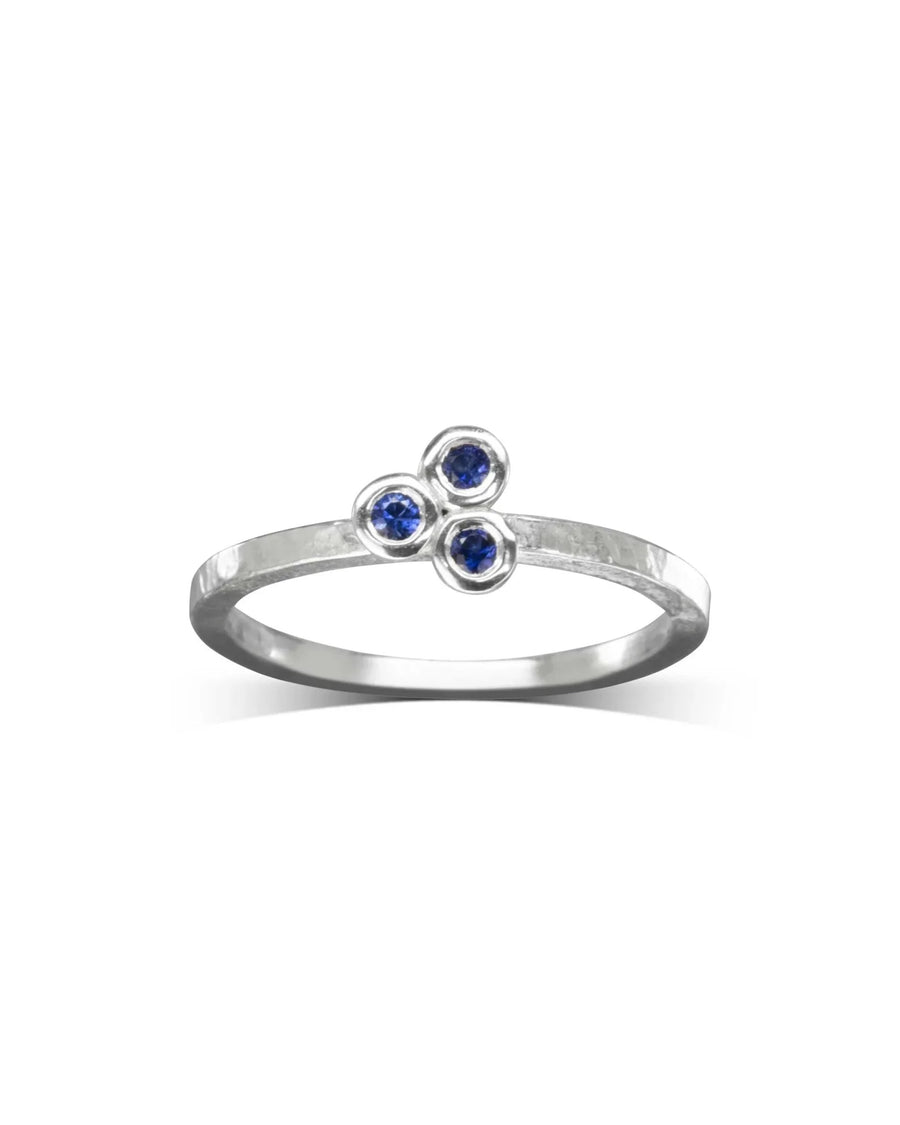9ct white gold ring with three round royal blue sapphire gemstones.