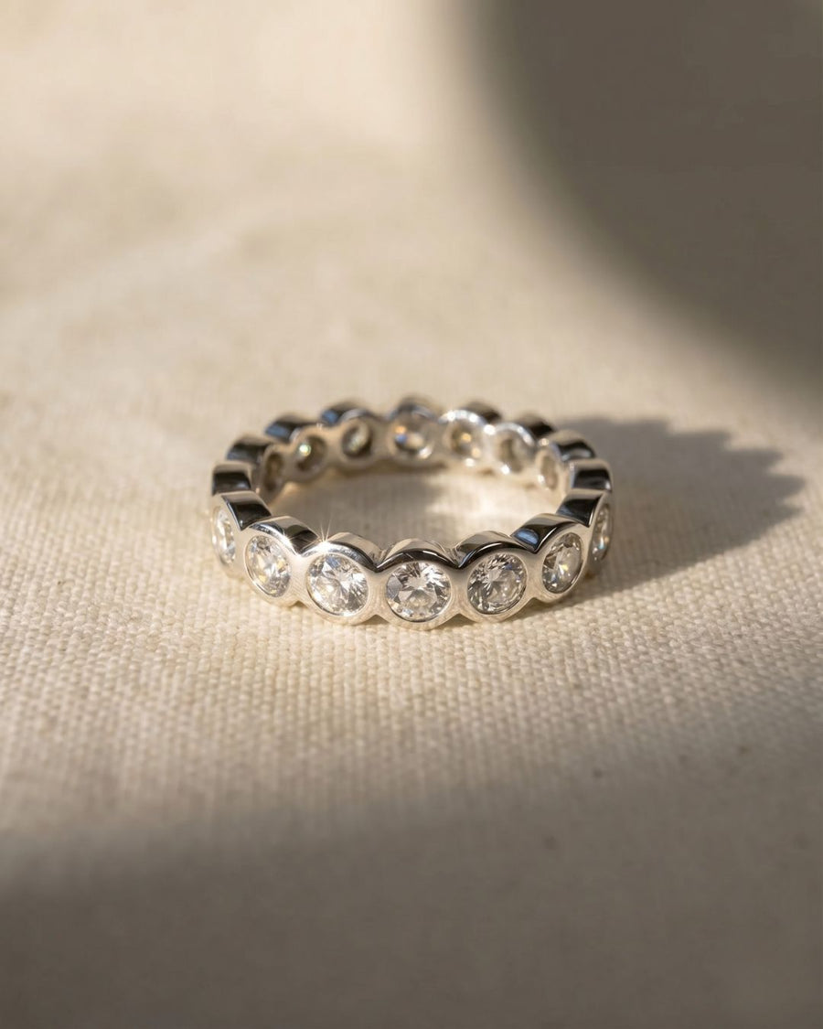 Platinum full eternity ring with tube form set round diamonds.
