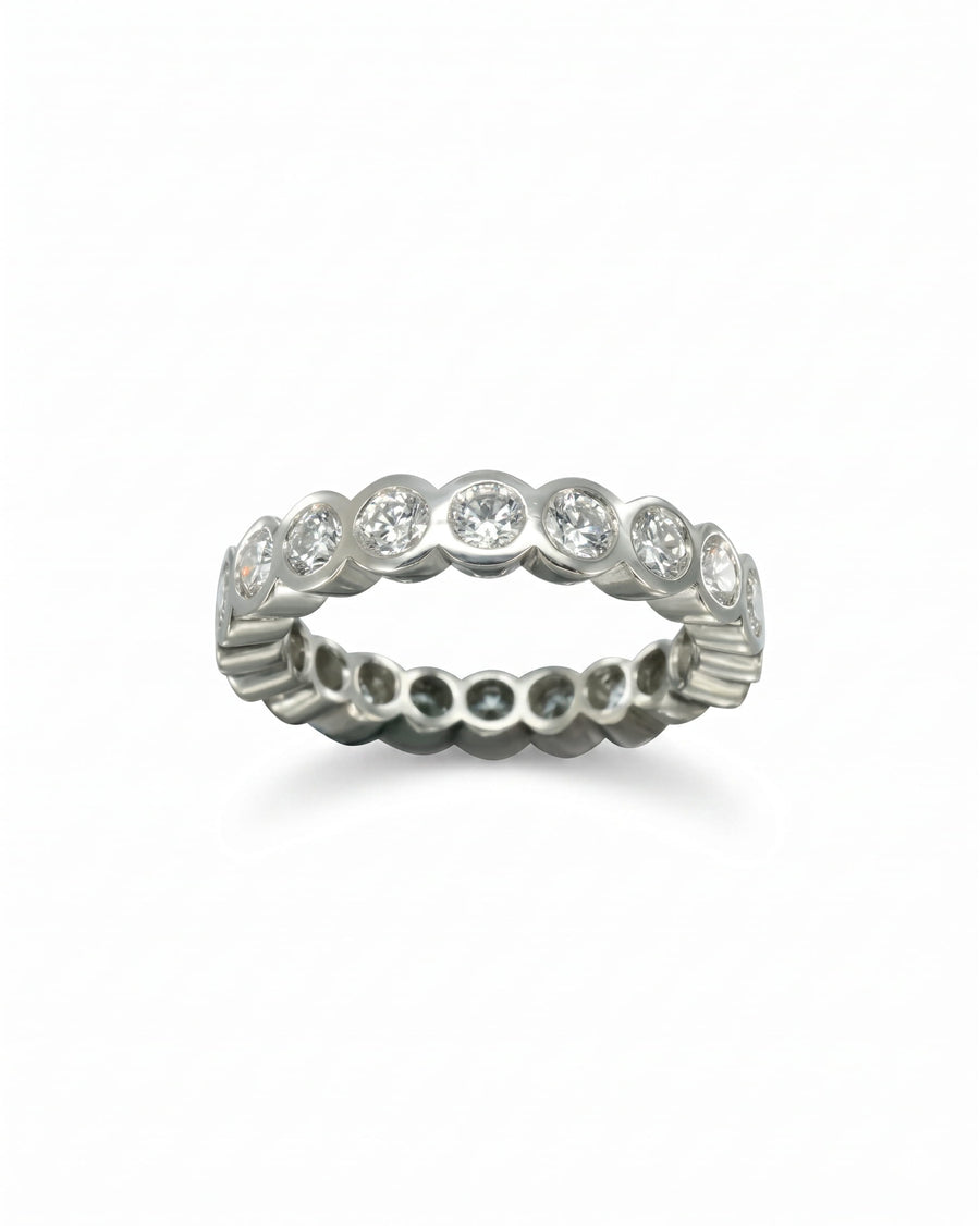 Platinum tube form full eternity ring with round diamonds.
