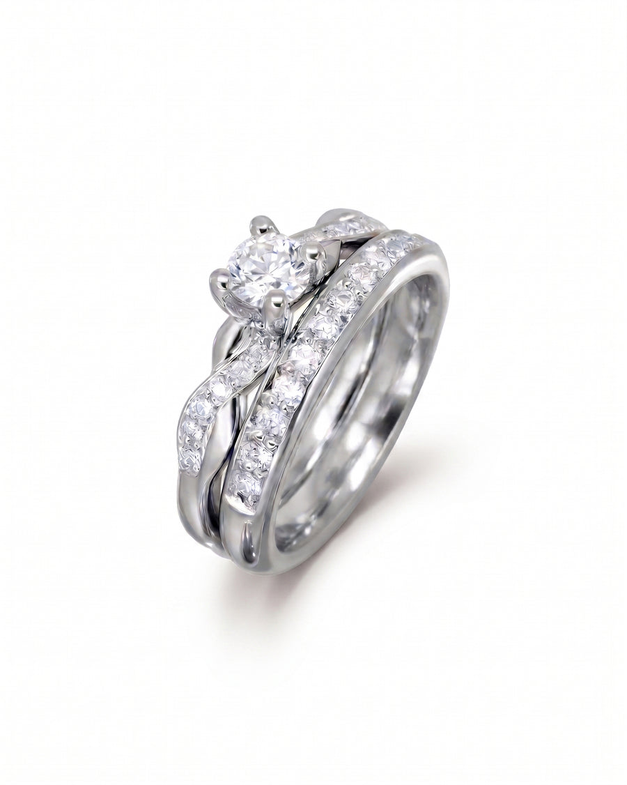 Silver twist engagement ring and wedding band set with round diamonds.
