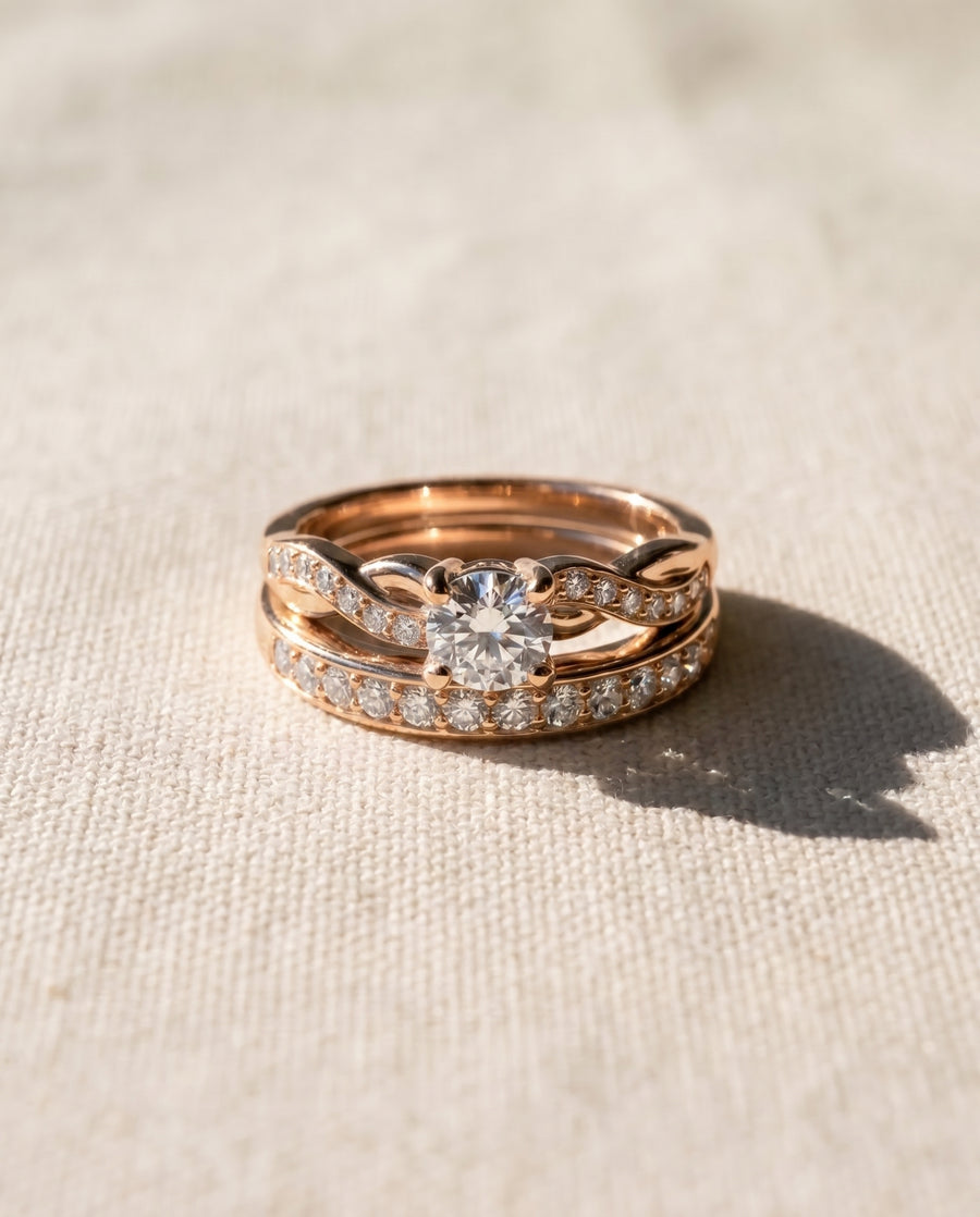 18ct rose gold twist engagement ring and wedding band set with diamonds.