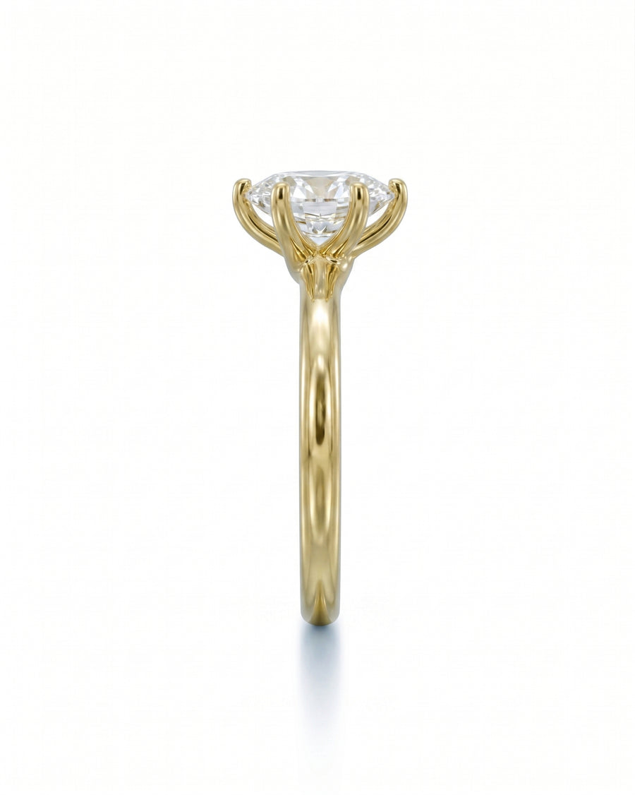 Yellow gold engagement ring with a large oval diamond in a six-prong twist setting.