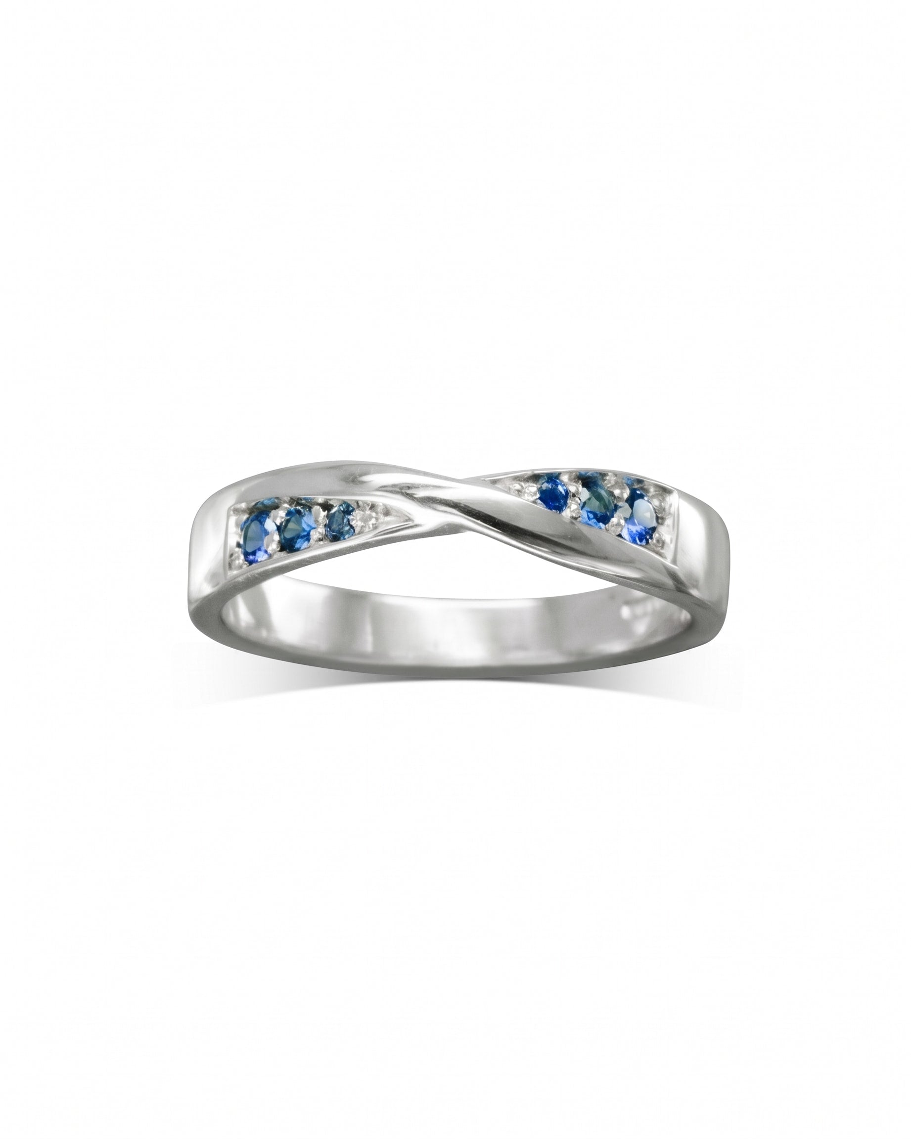 Silver twist ring with blue sapphire gemstones.