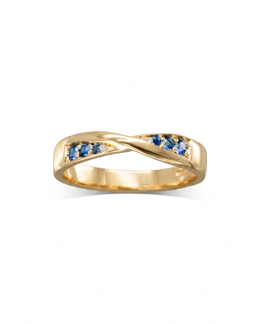 Gold twist ring with blue sapphires and small diamonds.