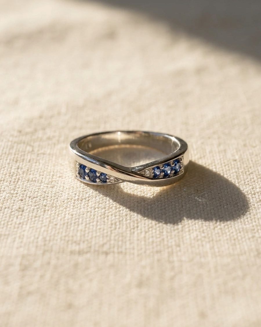 9ct white gold twist ring with blue sapphires and diamonds.
