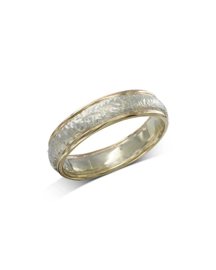 Handcrafted textured two-tone wedding band with gold edges and silver center on white background