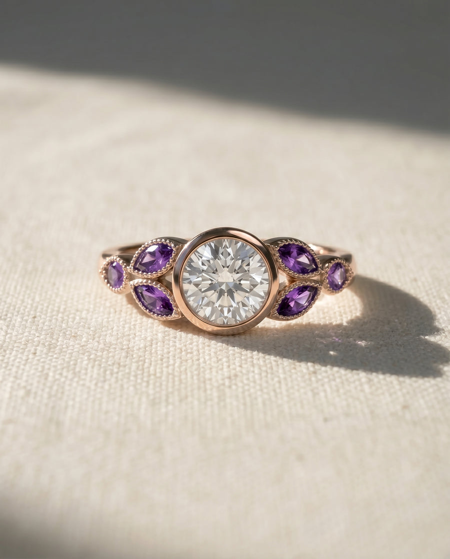 18ct rose gold engagement ring with a round diamond and marquise amethysts.