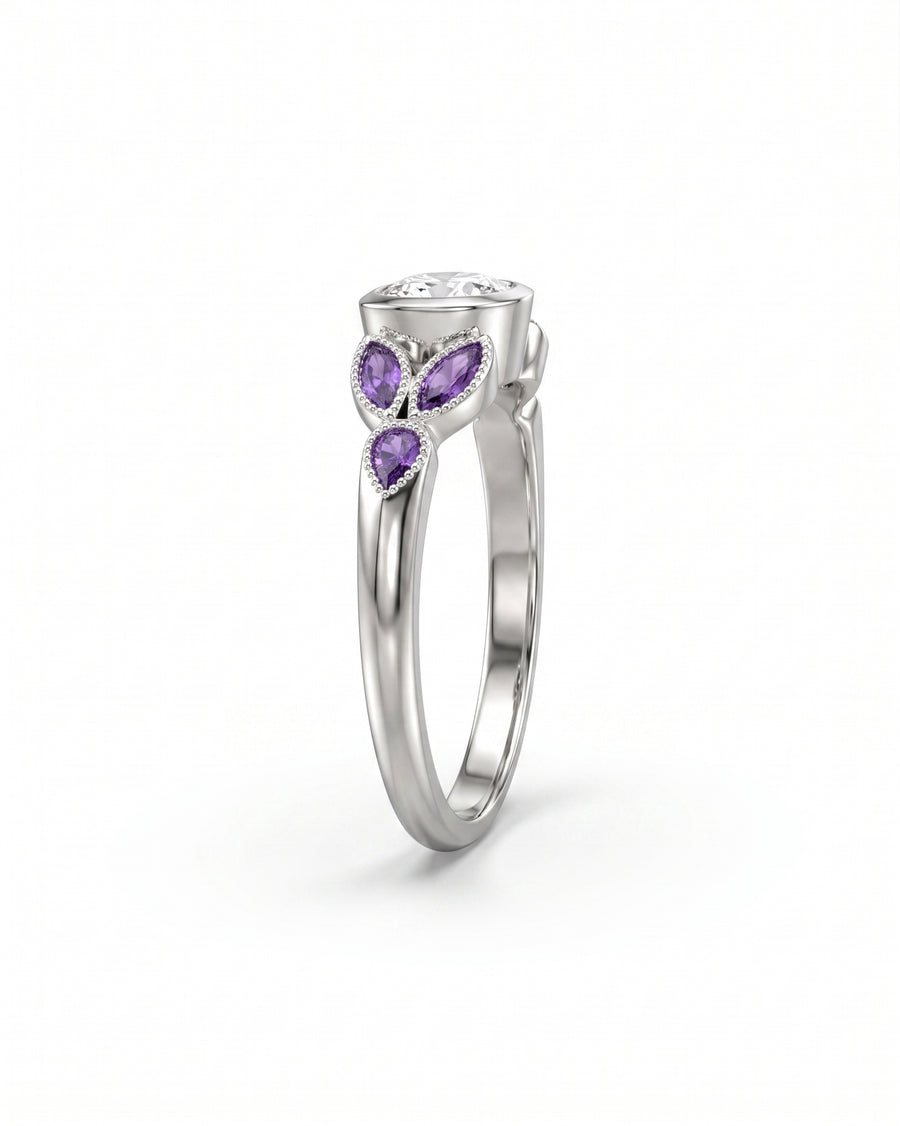 Silver ring with a large oval diamond and three pear-shaped amethyst side stones.