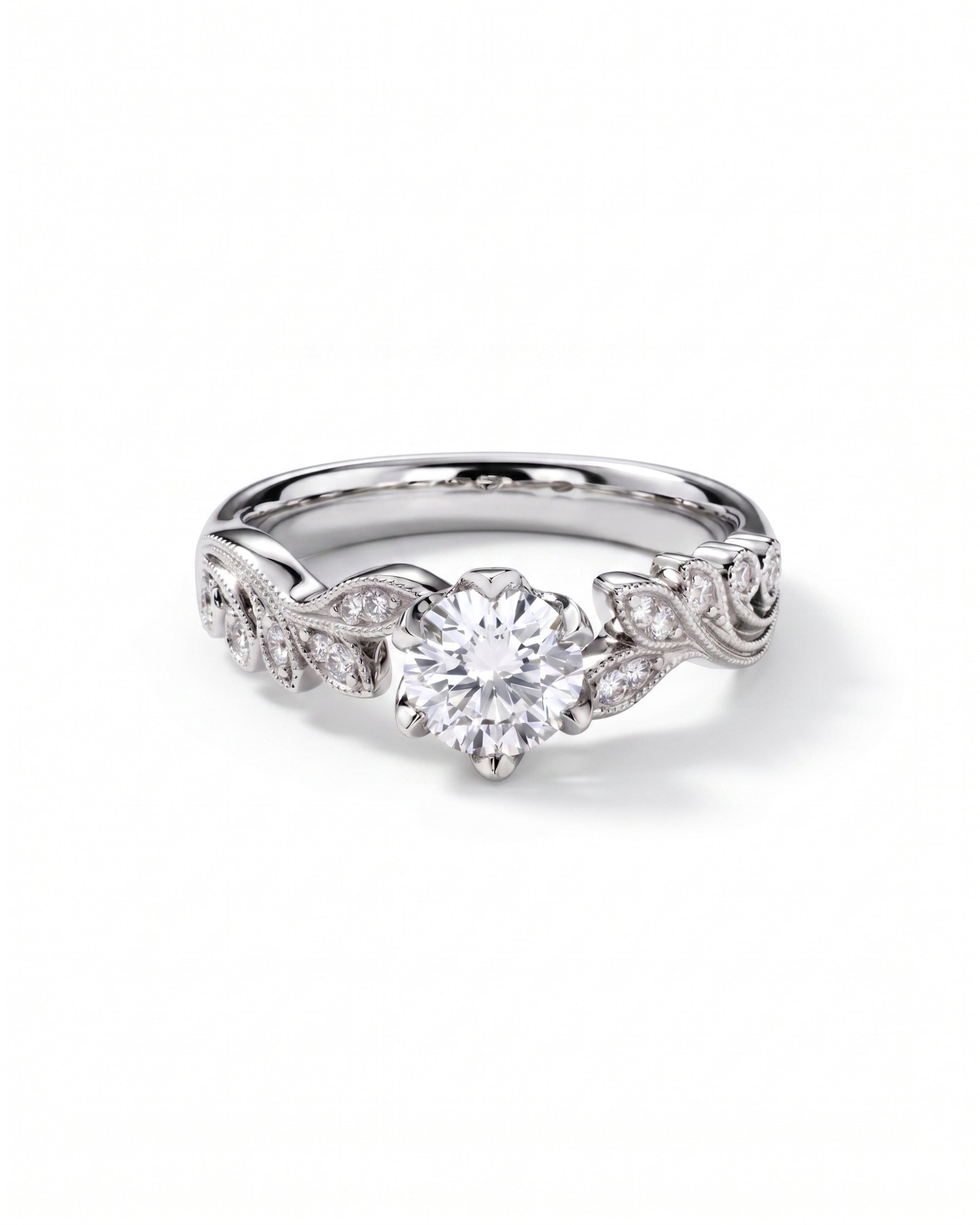 Silver ring with a round diamond center stone and leaf-shaped diamond accents.