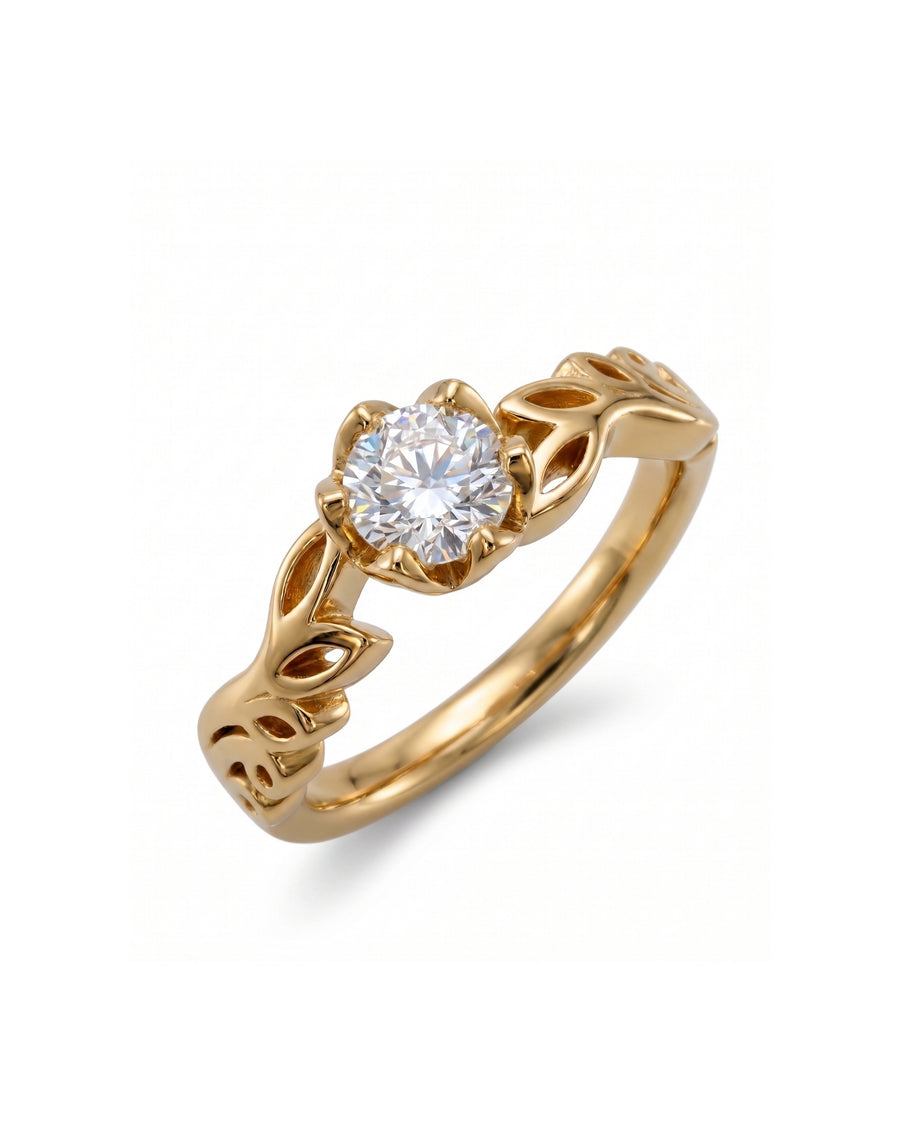 Gold ring with a round diamond and leaf-shaped band.