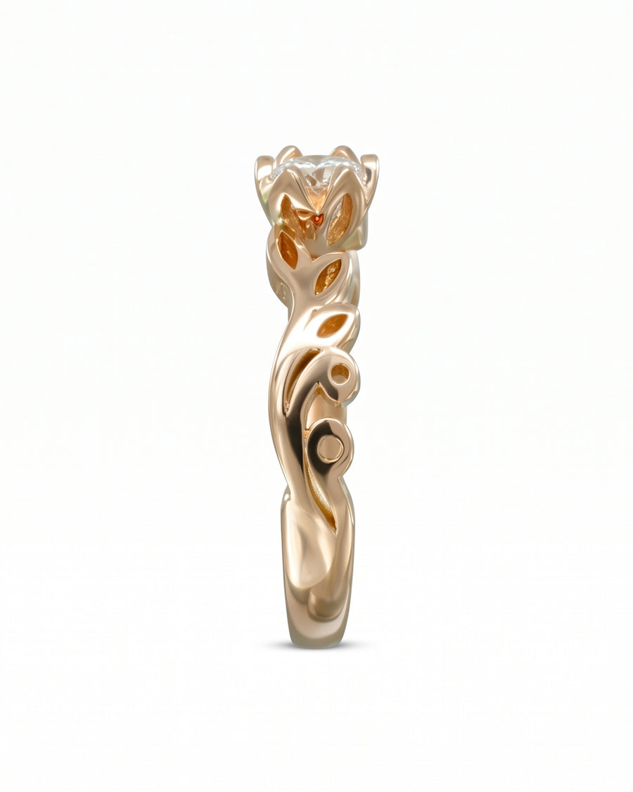 Rose gold diamond engagement ring with a vintage vine design.