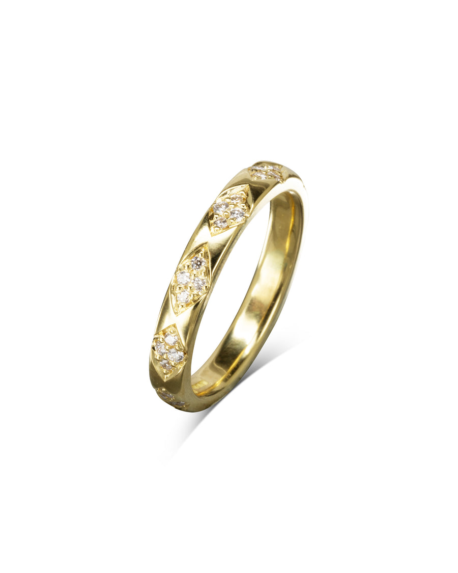 Gold ring with diamond pattern and small diamonds.