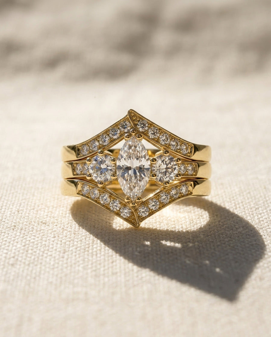 Gold marquise cut diamond engagement wedding ring set.