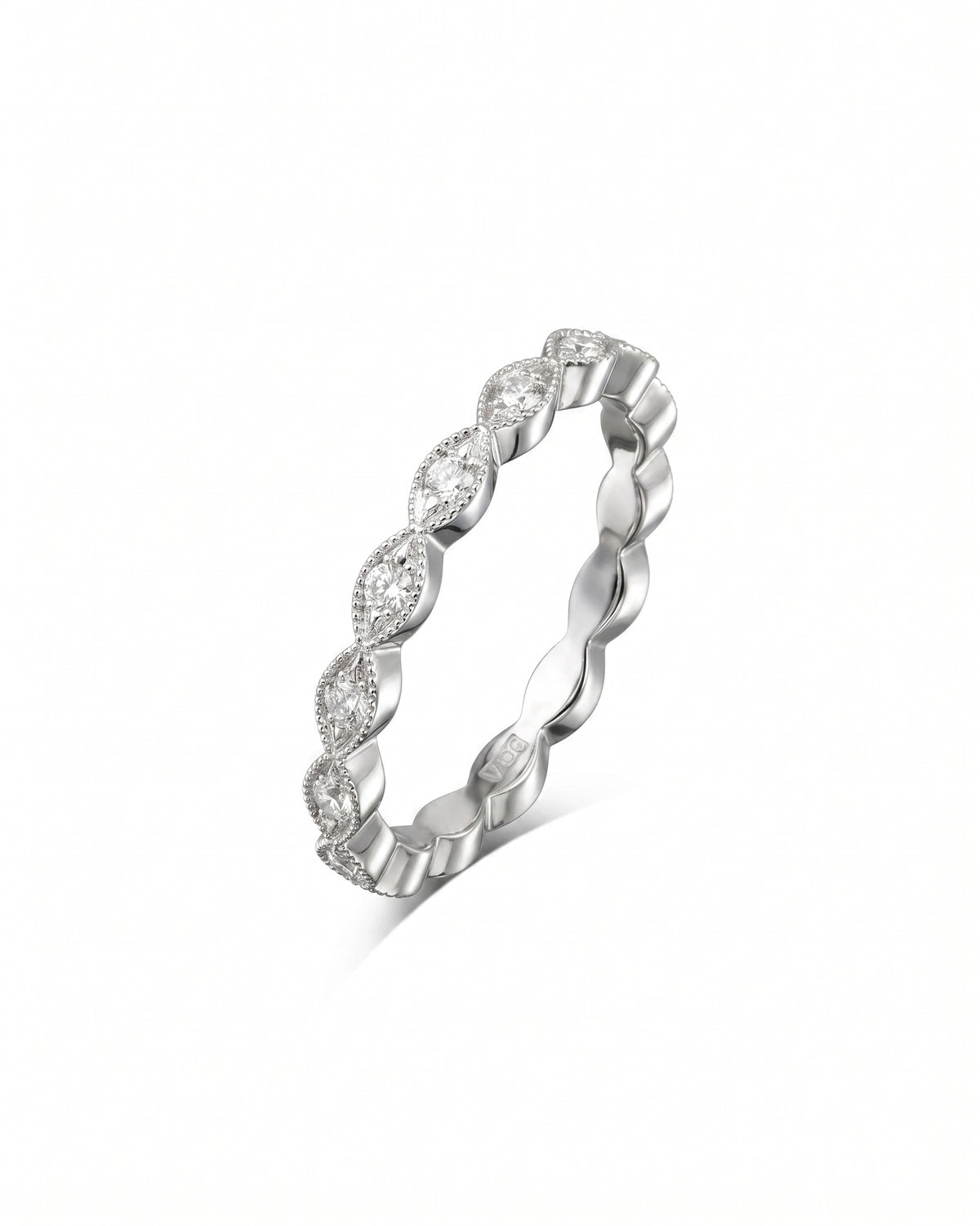 Silver eternity ring featuring marquise-shaped diamonds set in a vintage-style milgrain band.