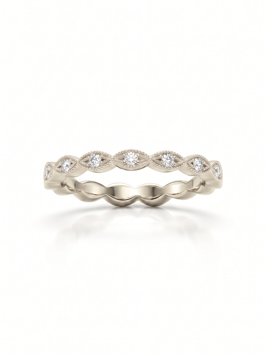 Vintage-style gold band featuring marquise-shaped settings with small round diamonds and milgrain detailing.