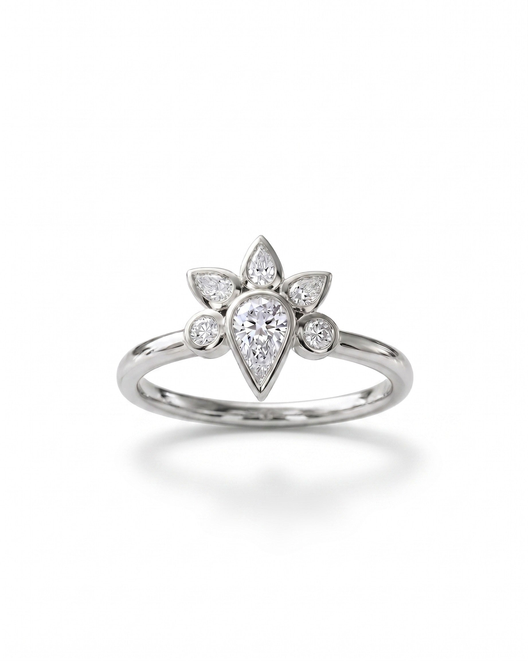Silver ring with a pear-shaped diamond surrounded by smaller marquise and round diamonds in a peacock cluster design.