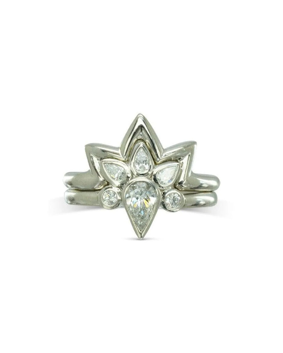 Silver peacock diamond cluster engagement ring with a pear-shaped center stone.