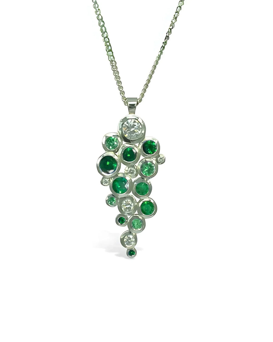 9ct white gold pendant with emeralds and diamonds in a bubble cluster design.