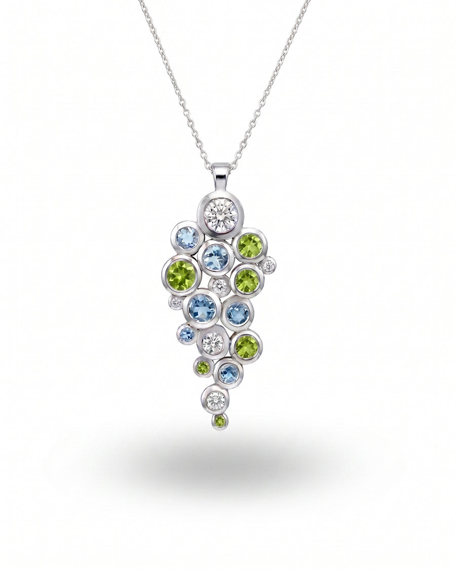 9ct white gold pendant with peridot, aquamarine, and diamond cluster.