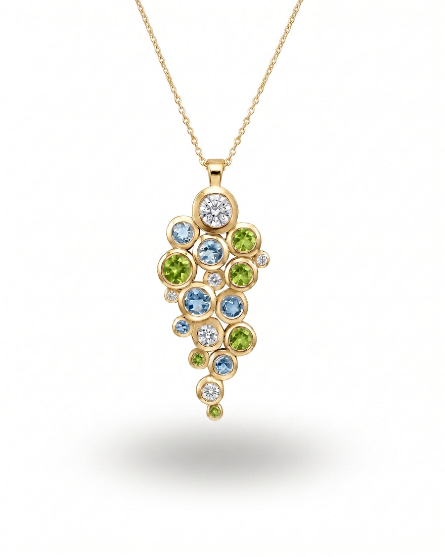 9ct yellow gold pendant with peridot, aquamarine, and diamond cluster.