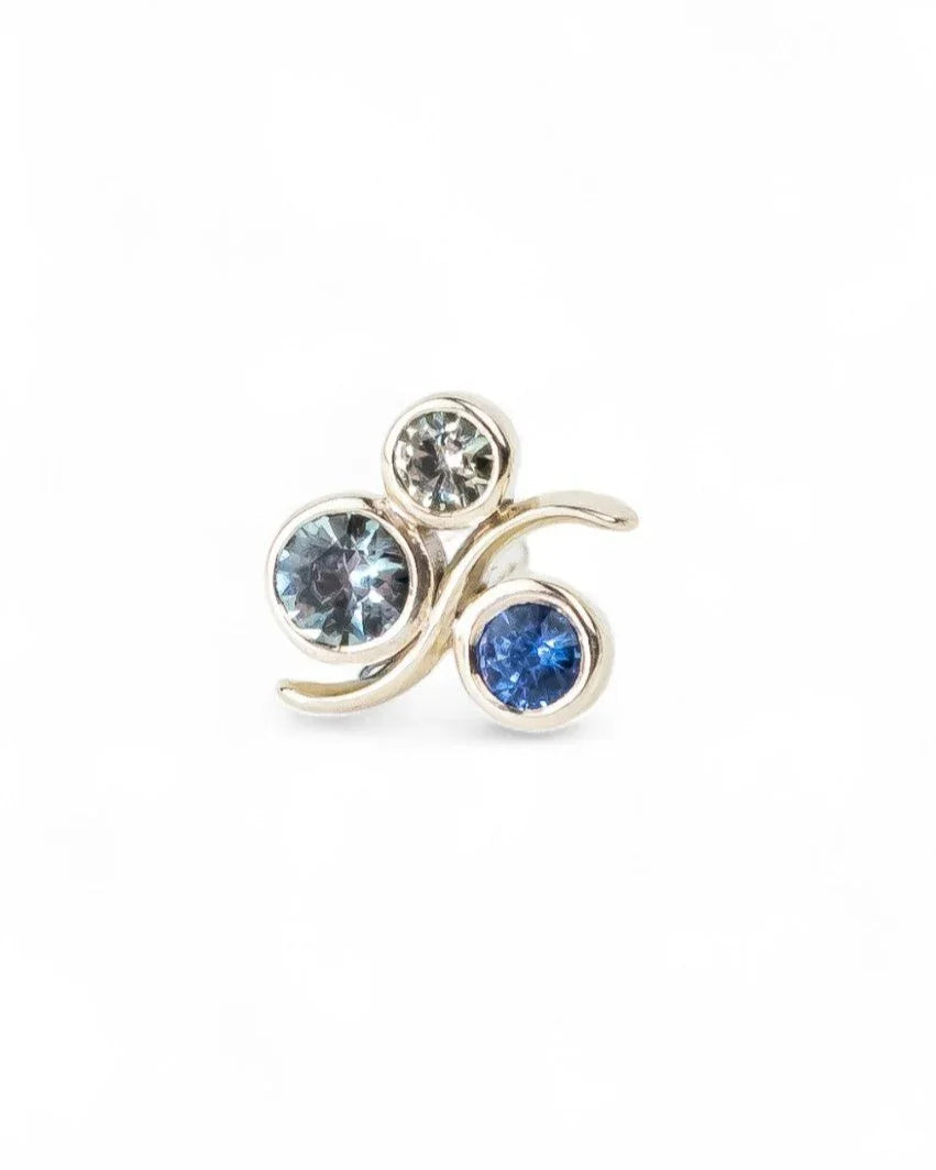 White gold stud earring with three round blue and sapphire gemstones in a bubble design