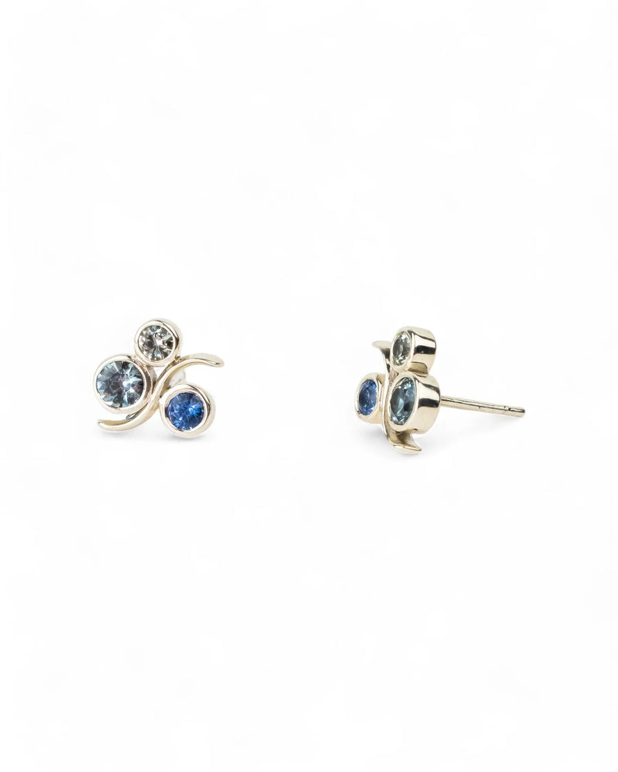 White gold sapphire stud earrings with organic bubble design on white background